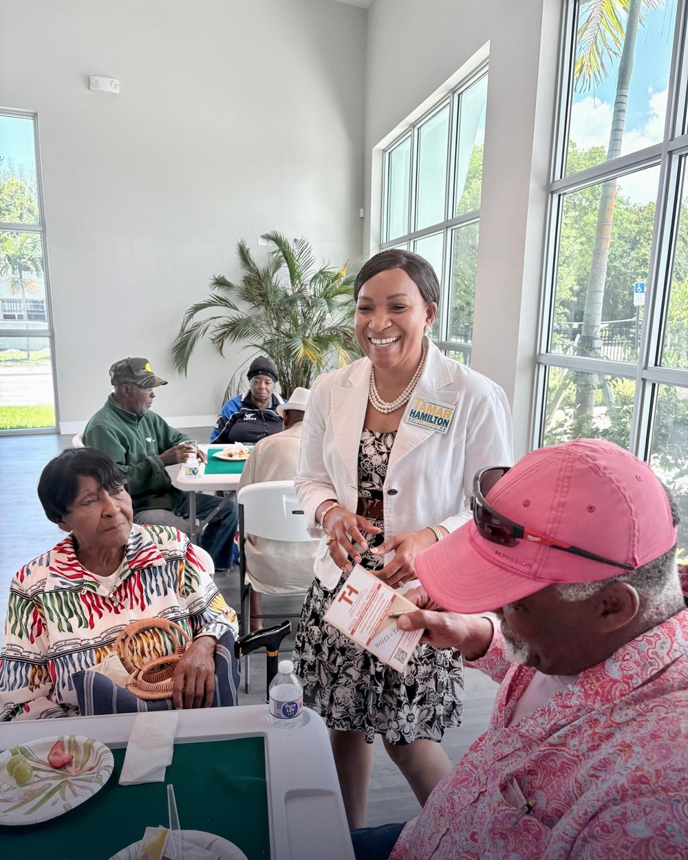 Tamar Hamilton greeting a supporter at a Broward County senior center